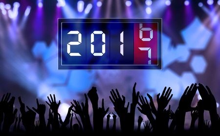 Silhouette of crowd hands people celebrate new year and count down time with number 2017の写真素材