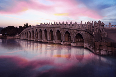 Image of beautiful twilight sky and stone bridge at the Summer Palace, Beijingの写真素材