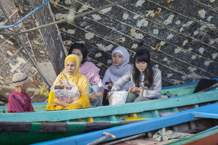 JAKARTA, Indonesia. April 18, 2017: Muslim people sitting in the boat after praying in the mosqueのeditorial素材