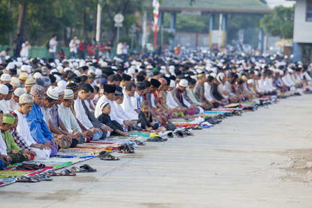 JAKARTA, Indonesia. April 18, 2017: crowd Muslim is praying and celebrating Eid Mubarak in the harbourのeditorial素材