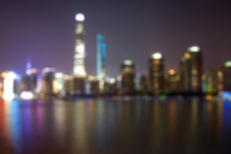 Blurred background with colorful blurry lights and buildings at Lujiazui financial center in Shanghai, Chinaの写真素材