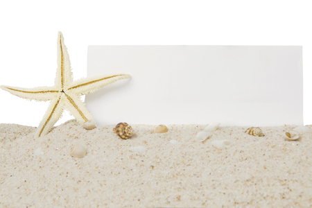 Vacation concept. Sea star on the white beach sand with seashells and empty banner, isolated on white backgroundの写真素材