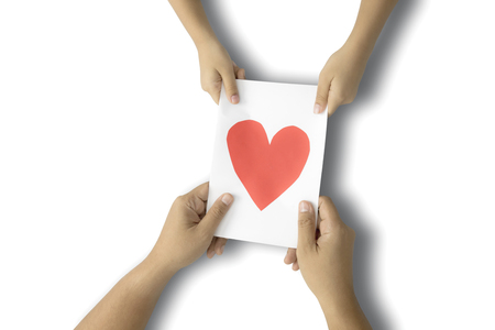 Father's Day. Child hands gives father's day greeting card to her father, isolated on white backgroundの写真素材