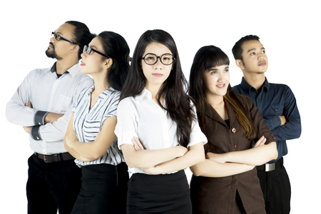 Picture of a beautiful boss looks confident while standing with her colleagues, isolated on white backgroundの写真素材