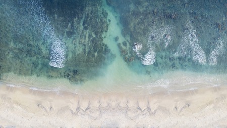 Top view of beautiful white sand with clear turquoise waterの写真素材