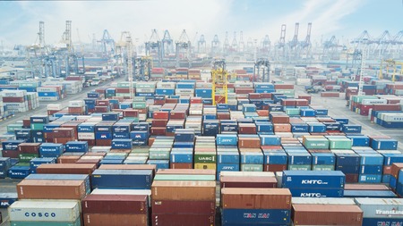 JAKARTA, Indonesia. July 10, 2017: Aerial view of many containers and cranes with container ship berthing at industrial portのeditorial素材