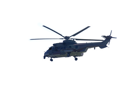 Image of army helicopter hovering in the studio, isolated on white background