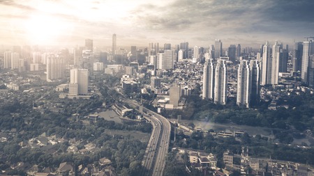 JAKARTA, Indonesia. May 12, 2017: aerial view over downtown with river. shot at sunset timeのeditorial素材