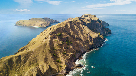 Bird view of beautiful Padar island under blue skies, East Nusa Tenggara, Indonesiaの写真素材