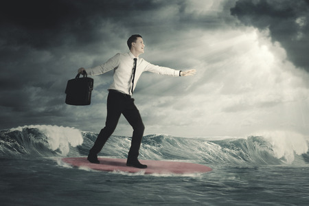 Worry free caucasian businessman surfing in a cloudy dayの写真素材
