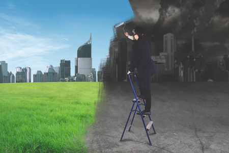 Go Green concept: Businessman creating a better working environment