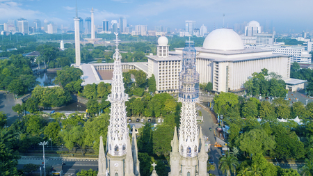 Beautiful aerial view of Cathedral Church and Istiqlal mosque at Jakarta, Indonesiaの写真素材