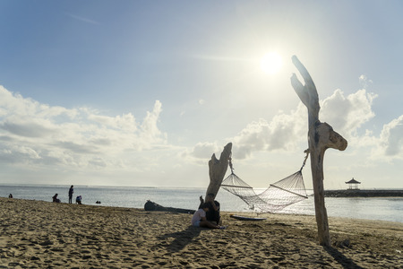 BALI - Indonesia. April 10, 2018: Tourists vacating on the Sanur beach in Bali, Indonesiaのeditorial素材