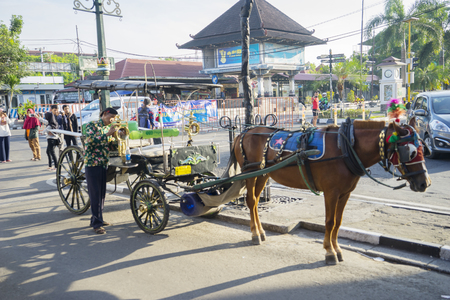 Yogyakarta - Indonesia. April 10, 2018: Horse carriage expecting customers to travel on the Malioboro streetのeditorial素材