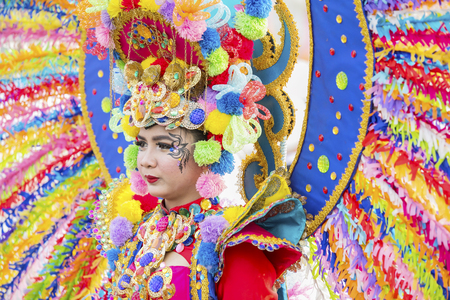 JEMBER - Indonesia. May 21, 2018: Colorful costumes worn by a participant at annual parade in Jember Festival Carnavalのeditorial素材
