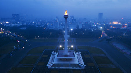 JAKARTA - Indonesia. May 21, 2018: Aerial view of National Monument with Istiqlal mosque and skyscrapers at night timeのeditorial素材