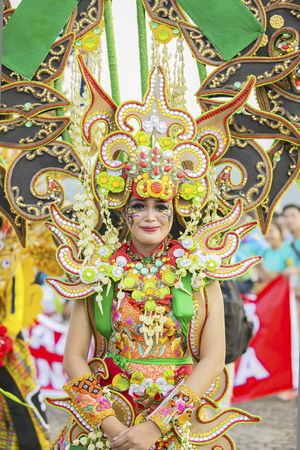 JEMBER - Indonesia. May 21, 2018: Beautiful costumes worn by a participant at annual parade in Jember Festival Carnavalのeditorial素材