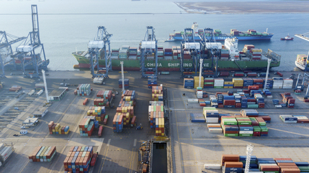 JAKARTA - Indonesia. July 05, 2018: Aerial view of container vessel unloaded while berthing in Tanjung Priok industrial port, Indonesiaのeditorial素材