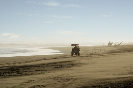 YOGYAKARTA - Indonesia. JULY 19, 2018: Image of horse carriage crossing beautiful beach in Yogyakarta, Indonesiaのeditorial素材