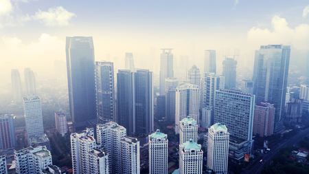 JAKARTA - Indonesia. August 31, 2018: Aerial view of skyscrapers with air pollution at morning time in Jakartaのeditorial素材