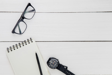 Top view of glasses, wristwatch, and paper notes with copy space on the working desk. Father's day conceptの写真素材