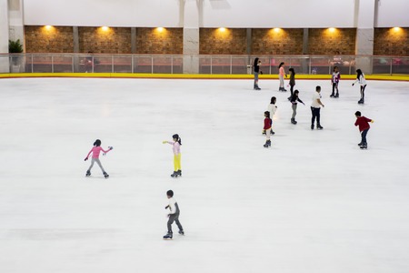 JAKARTA - Indonesia. October 15, 2018: Crowded people playing ice skating at modern mall. Shot in Jakarta, Indonesiaのeditorial素材