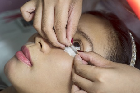 Close up of Asian woman ready to eyelash extension treatment in a beauty salon