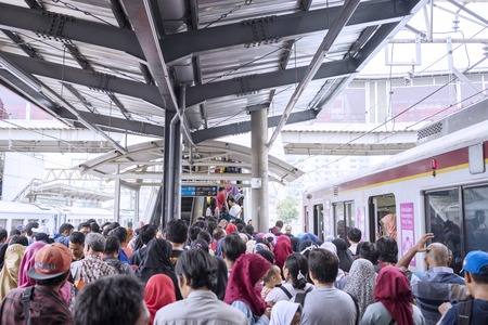 JAKARTA - Indonesia. November 09, 2018: Crowded people waiting commuter train arrival in Jakarta, Indonesiaのeditorial素材