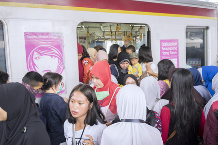 JAKARTA - Indonesia. November 09, 2018: Crowded people stepping inside train that just arrived at the stationのeditorial素材