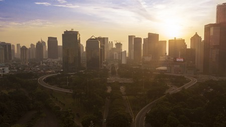 JAKARTA - Indonesia. November 14, 2018: Silhouette of office buildings with Semanggi intersection at sunset time in Jakarta downtownのeditorial素材