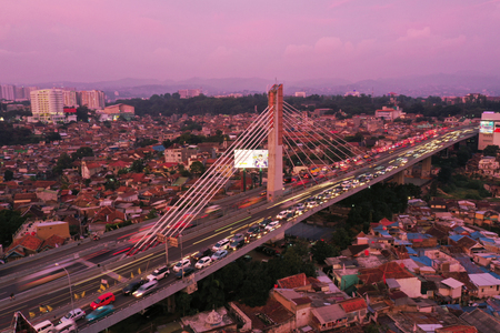 Bandung - Indonesia. January 03, 2019: Aerial view of crowded residential houses with Pasupati overpass at dawn timeのeditorial素材