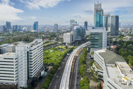 JAKARTA - Indonesia. January 03, 2019: Aerial view of skyscrapers with railway LRT in Jakarta cityのeditorial素材