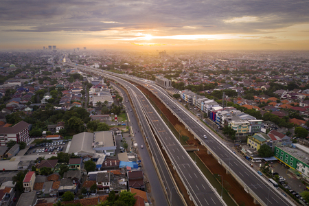 JAKARTA, Indonesia - January 02, 2019: Beautiful aerial view of Becakayu toll road at sunrise time in Jakarta, Indonesiaのeditorial素材