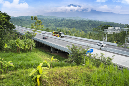 Ungaran, Central Java, Indonesia - January 18, 2019: Aerial view of Trans-Java Tollway bridge with mountain view at Semarang, Central Java, Indonesiaのeditorial素材