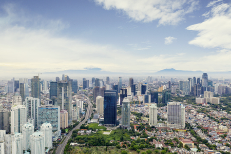 JAKARTA - Indonesia. February 18, 2019: Drone view of Jakarta city with modern office buildings under blue skyのeditorial素材