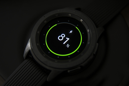 JAKARTA - Indonesia. March 22, 2019: Close up of a Samsung Galaxy watch charging with wireless chargingのeditorial素材