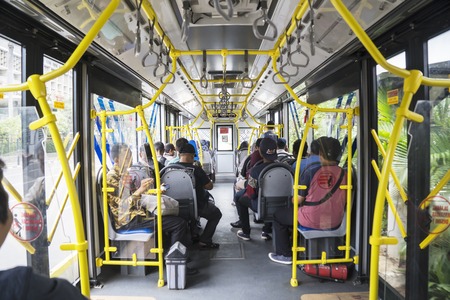 JAKARTA - Indonesia. March 20, 2019: Interior of Transjakarta bus with passengers
