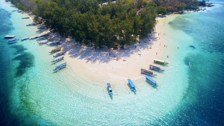Bali - Indonesia. April 09, 2019: Aerial view of traditional boats anchored on the Gili Rengit beach in Lombok, Indonesiaのeditorial素材