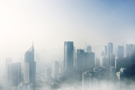 JAKARTA - Indonesia. April 24, 2019: Aerial view of misty Jakarta cityscape with skyscrapers at morning timeのeditorial素材