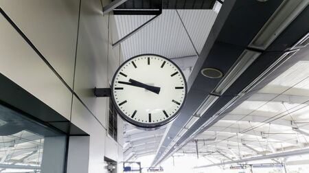 Image of modern clock attached at MRT station in Jakarta cityの写真素材