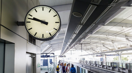 JAKARTA - Indonesia. June 25, 2019: Image of clock with crowded passengers waiting Jakarta MRT arrival at the stationのeditorial素材