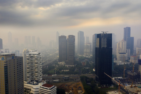JAKARTA - Indonesia. July 15, 2019: Aerial view of Jakarta city covered by air pollution at morning timeのeditorial素材