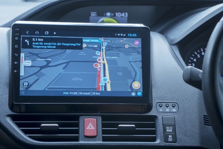 JAKARTA - Indonesia. September 18, 2019: Close up of car dashboard with GPS navigation device...