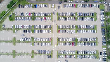 JAKARTA - Indonesia. October 01, 2019: Top view of crowded cars in supermarket parking lot
