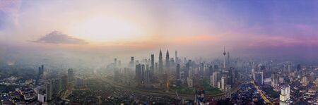 Wide panorama image of Kuala Lumpur, Malaysia at sunrise