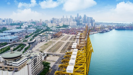 SINGAPORE. October 12, 2017: Side view of harbor with containers and skyscrapersのeditorial素材