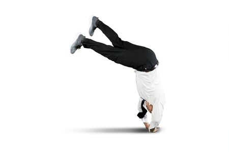 Businessman falling over isolated over white background