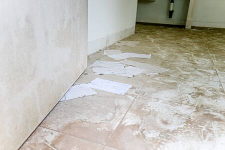 Dusty floor with mails on an abandoned houseの写真素材