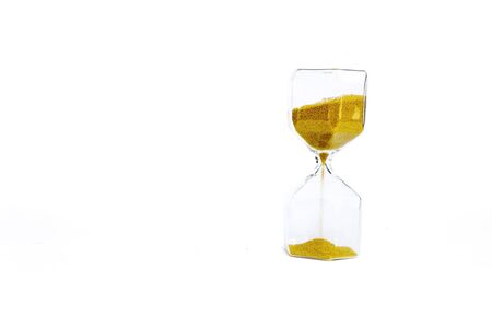 Transparent hourglass or sand clock with golden sand, isolated on white background