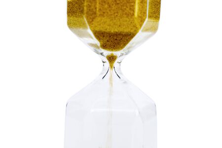 Golden sand inside transparent hourglass, isolated on white background